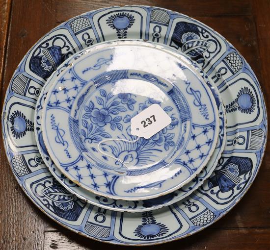 Three 18th century Delft plates Largest 13.5in.
